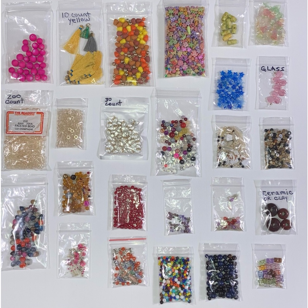 Lot of different types of beads & tassels for craft or jewelry making.